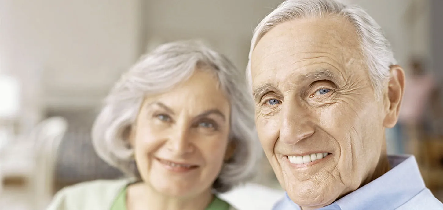 Smiling senior couple at home